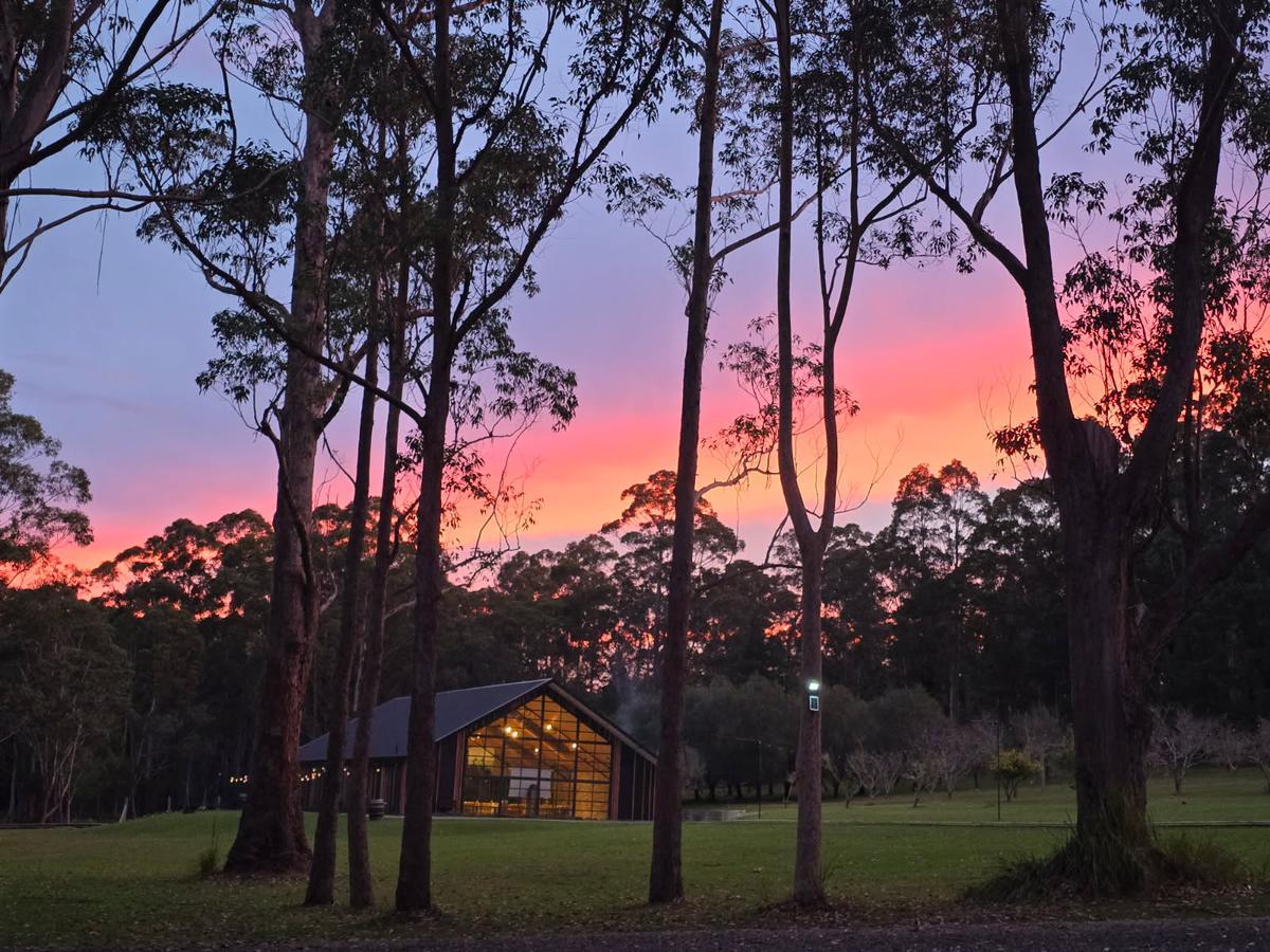 Sunset over the gums with the barn lit up below