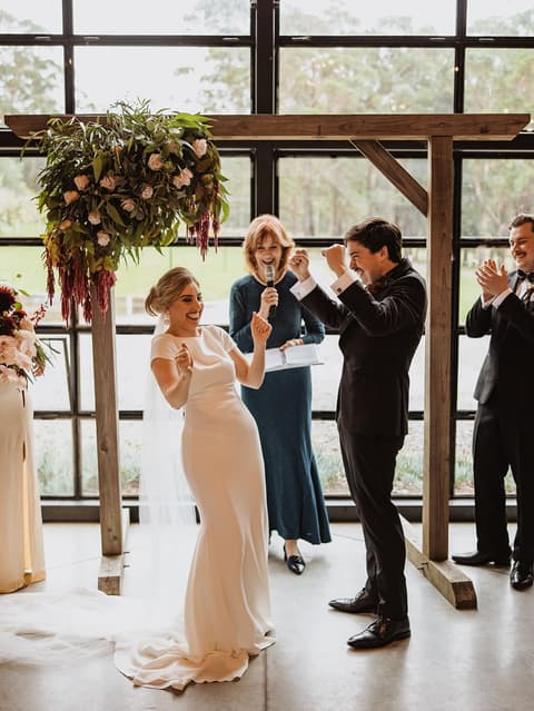 A beautiful indoor ceremony on a rainy day.