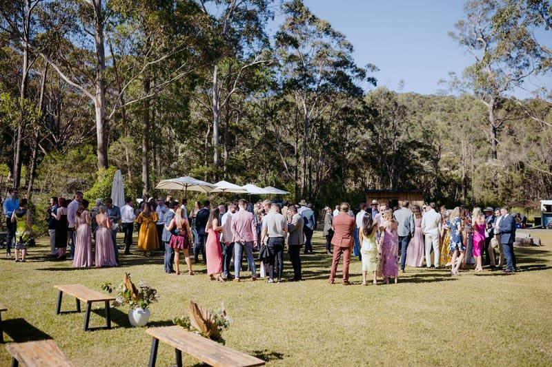 Guests gathered on the lawn for an outdoor ceremony